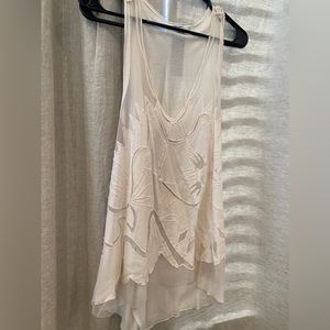 Free People white sleeveless tank with sheer cut out detail. XS